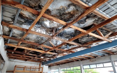Damaged wooden roof structure