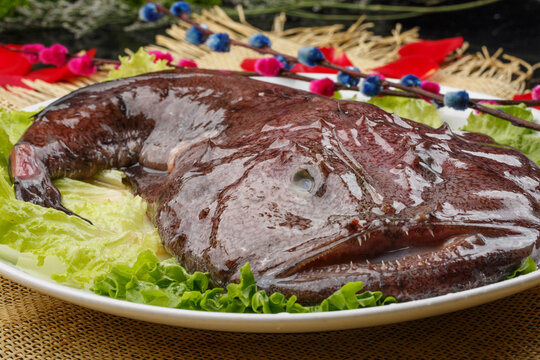 Deep sea manta ray on a white oval porcelain plate