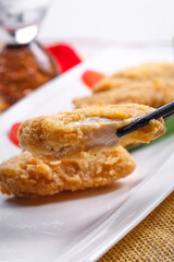 Fried chicken wings on a white porcelain plate