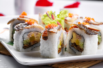 Assorted eel hand-rolled sushi on the sushi curtain