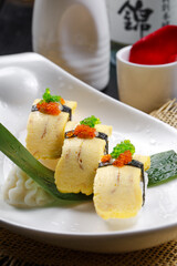 Miss Tamago's seaweed egg omelette sushi is placed on a straw mat