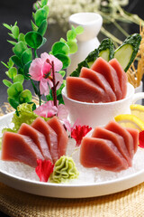Ultra-low temperature tuna sashimi is placed on a straw mat