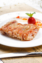 Crispy sizzling chicken steak on English wrapping paper