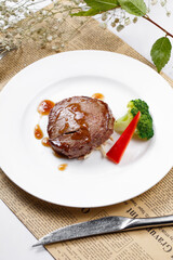 French fried fillet steak on English wrapping paper