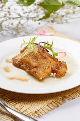 Grilled codfish with teriyaki sauce on a straw mat