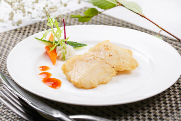 Japanese style grilled grouper on a placemat