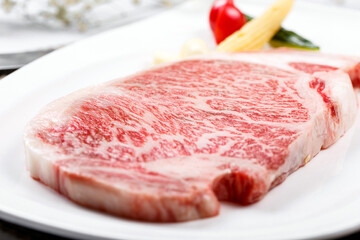 Top-grade A5A3 marbled steaks are placed on the placemat