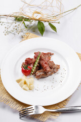 Sizzling Australian flank steak on a straw mat