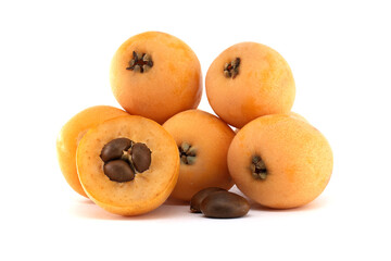 Loquat fruits, Eriobotrya japonica, showing seeds isolated on white background