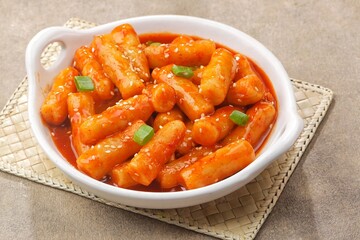 Tteokbokki is a Korean dish of rice flour cooked in spicy and sweet gochujang seasoning