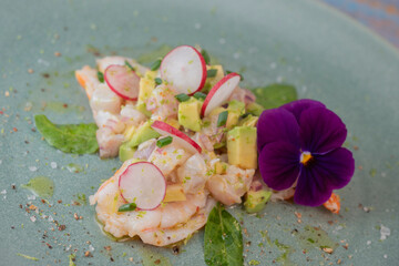 Delightful ceviche made with fresh dorade and shrimp, complemented by avocado and radish, garnished...