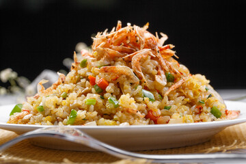 Sizzling shrimp fried rice on a straw mat