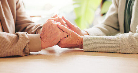 Holding hands, support and senior couple in home with comfort, bonding or connection in relationship. Empathy, trust and elderly man with woman for care, love and marriage in retirement house.