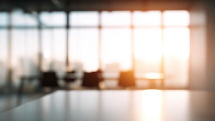 Softly blurred bright office with glass windows, sunlight, modern workspace, empty, peaceful morning