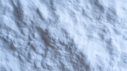 Top flat view of close up natural snow texture, soft white surface, cold winter background