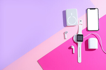 Set of modern gadgets on color background