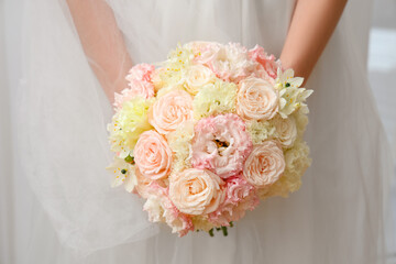 Beautiful bride with wedding bouquet, closeup