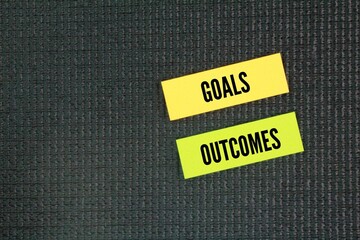 Paper with two words goals and outcomes. Goals are generally not measurable, while outcomes are...