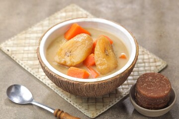 Kolak Pisang is an Indonesian dessert made from bananas, pumpkin cooked with coconut milk, palm sugar and pandan leaves.