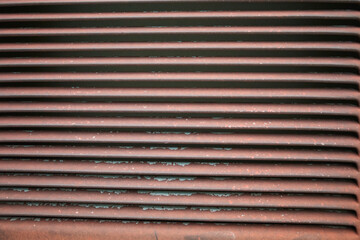Rusted iron walls. Gardening. Old woodblocks. Brown rust.