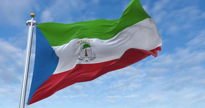 Equatorial Guinea flag with flagpole waving in wind, rolling clouds background looping, 4K video (Perfect Loop)