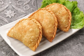 Pastel Goreng in Indonesia, pastel refers to a type of kue filled with meat, vegetables, and rice vermicelli deep fried in vegetable oil. It is consumed as a snack and commonly sold in Indonesian trad