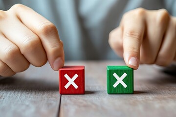 Two small wooden blocks, red and green, each marked with an 'X', are held by hands.  Decision-making process