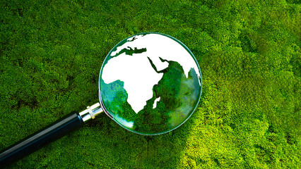 Magnifying glass with crystal globe, environment, save the world, world earth day, ecology and conservation concept..