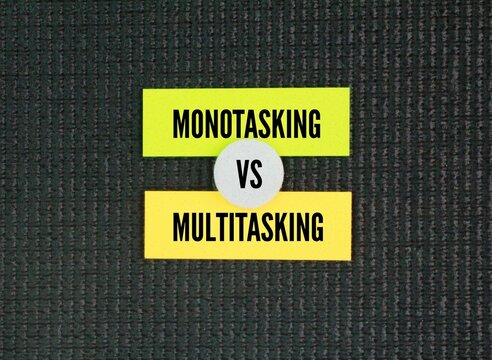Paper with two words Monotasking Vs Multitasking. Experts agree that monotasking, or single-tasking, is a much more effective way to tackle your to-do list and can help you become more productive