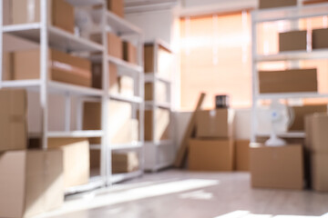 Blurred view of light warehouse with cardboard boxes on shelving units