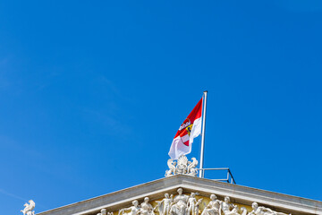 Flag of Austria and the year Vienna on a historical building. Facades of historical buildings Austria, Vienna