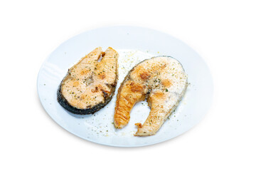 Top view of salmon grill on the white plate, focus selective