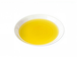 isolated white background Yellow olive oil in round white dish on plain background  