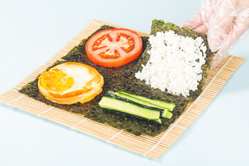 Close up of the process of making delicious sushi