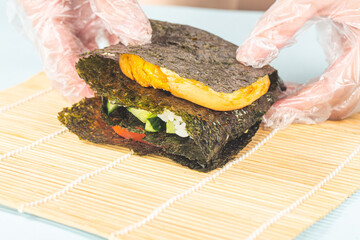 Close up of the process of making delicious sushi