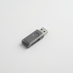 A sleek gray USB flash drive isolated on a white background, showcasing its compact design and practical utility.