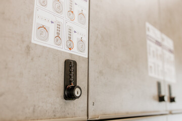 Close up of modern secure storage lockers with digital code locks and user instructions, located in...