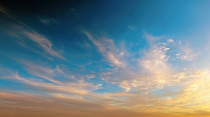 Fototapeta premium Deep Blue Sky Meeting Sunset Streaks Golden Clouds and Airy Atmosphere at Twilight