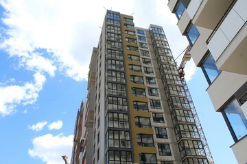 modern office building, large construction in the city, building under construction in the city