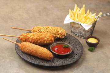 Corndog is a food made from skewered sausages (usually hot dogs) coated in a thick layer of...