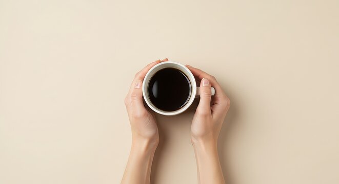 a hand holding a cup of coffee in a pastel-colored background