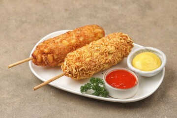 Corndog is a food made from skewered sausages (usually hot dogs) coated in a thick layer of...