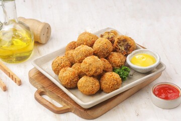 Bitterballen is the name of a type of food in the Netherlands. Bitterballen taste similar to croquettes, but are small round shapes about 3 to 4 cm