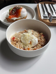 Savory Oatmeal Bowl with Tomato Sauce, Poached Egg, and Parmesan Cheese. Contemporary Outdoor Breakfast Theme. Modern Breakfast Out Concept. Handheld Phone Photo, Selective Focus, Sunlight, Non-AI
