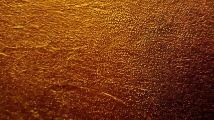 A golden texture background with a metallic sheen creates a luxurious and shiny abstract surface - Powered by Adobe