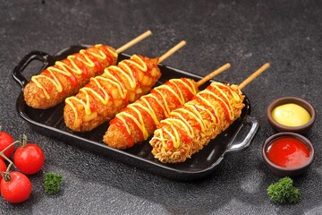 Corn dogs or corndog are a typical South Korean snack that combines sausages with thick flour dough