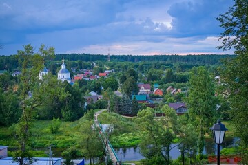 Russian suburb countryside area. Scenic top view of small town of Vereya, Moscow region. Picturesque rural landscape of small city in valley in cloudy summer day