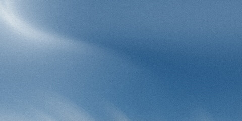 A blurred abstract background with a gradient of blue and white creates a textured and grainy visual effect