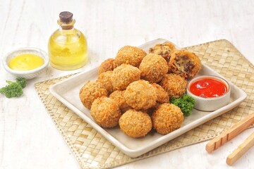 Bitterballen is the name of a type of food in the Netherlands. Bitterballen taste similar to croquettes, but are small round shapes about 3 to 4 cm
