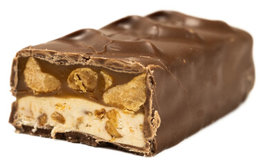 Delicious broken chocolate caramel nougat peanut candy bar with creamy filling and crunchy nuts on black background